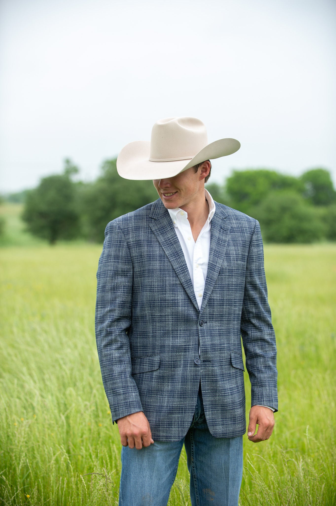 Dark grey fabric with navy plaid texture on slim fit cowboy sport jacket