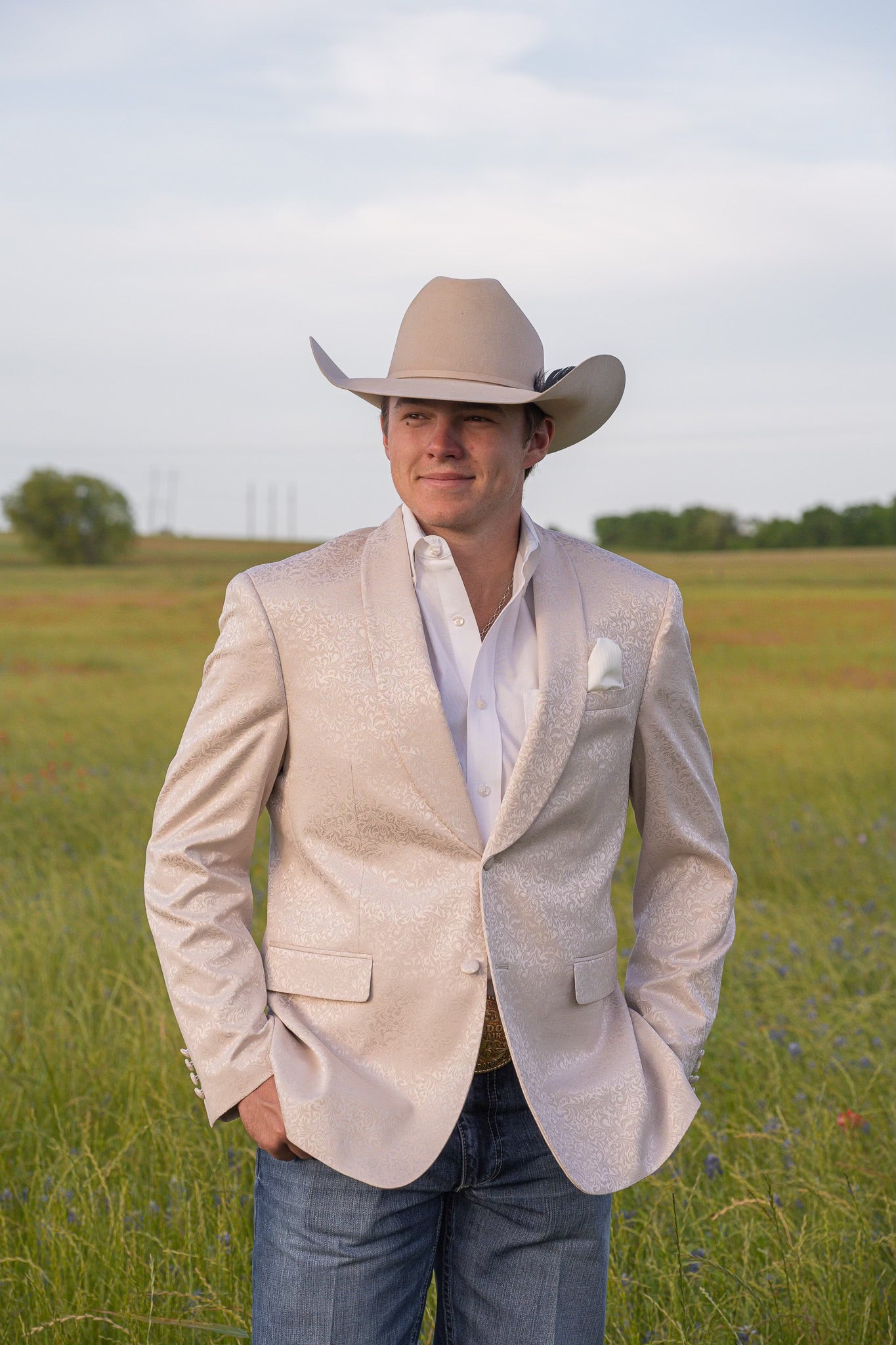 Close-up of pocket square on cream paisley cowboy sport coat for cowboy groom attire