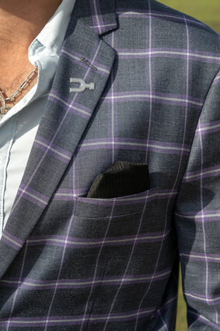 Close-up of a gray checkered blazer with a unique button design.