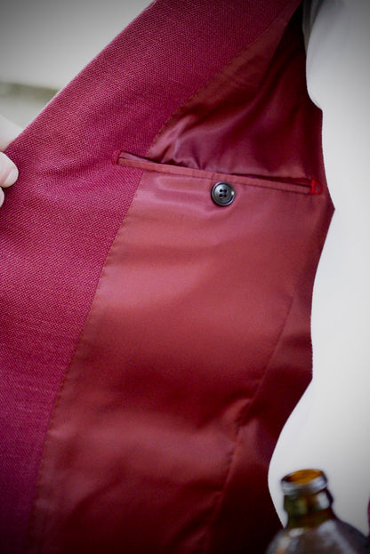 Close-up of red chino cowboy sport coat fabric and pocket detail — luxury western formalwear from Espuela Design Co.