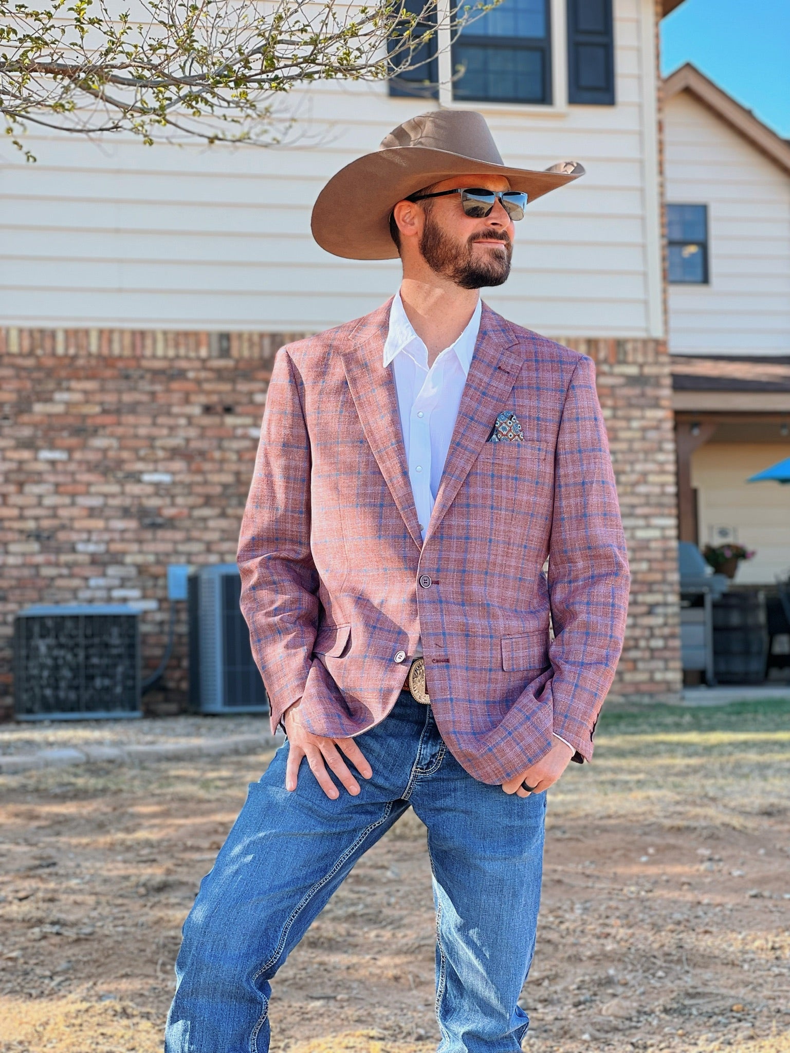 Brick Red Western suit coat paired with denim jeans and cowboy boots for Western lifestyle look